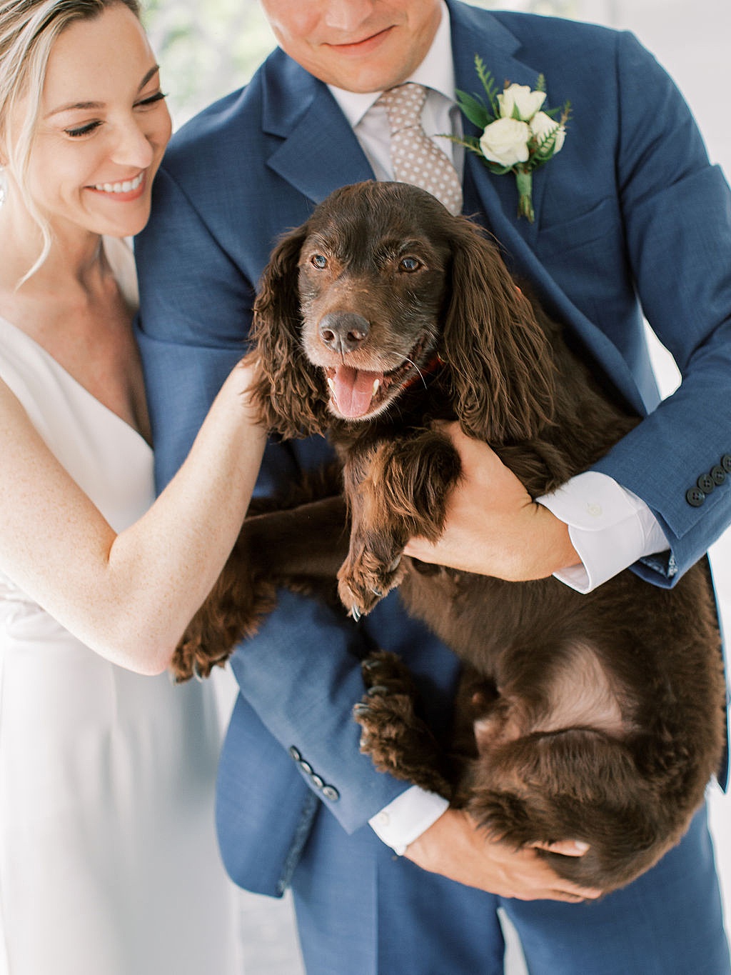 Bride and groom with their dog