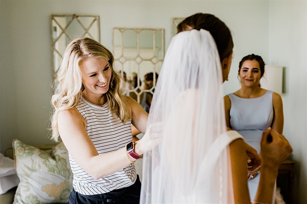 Wedding planner Laura Lyn Coody helps her bride get ready