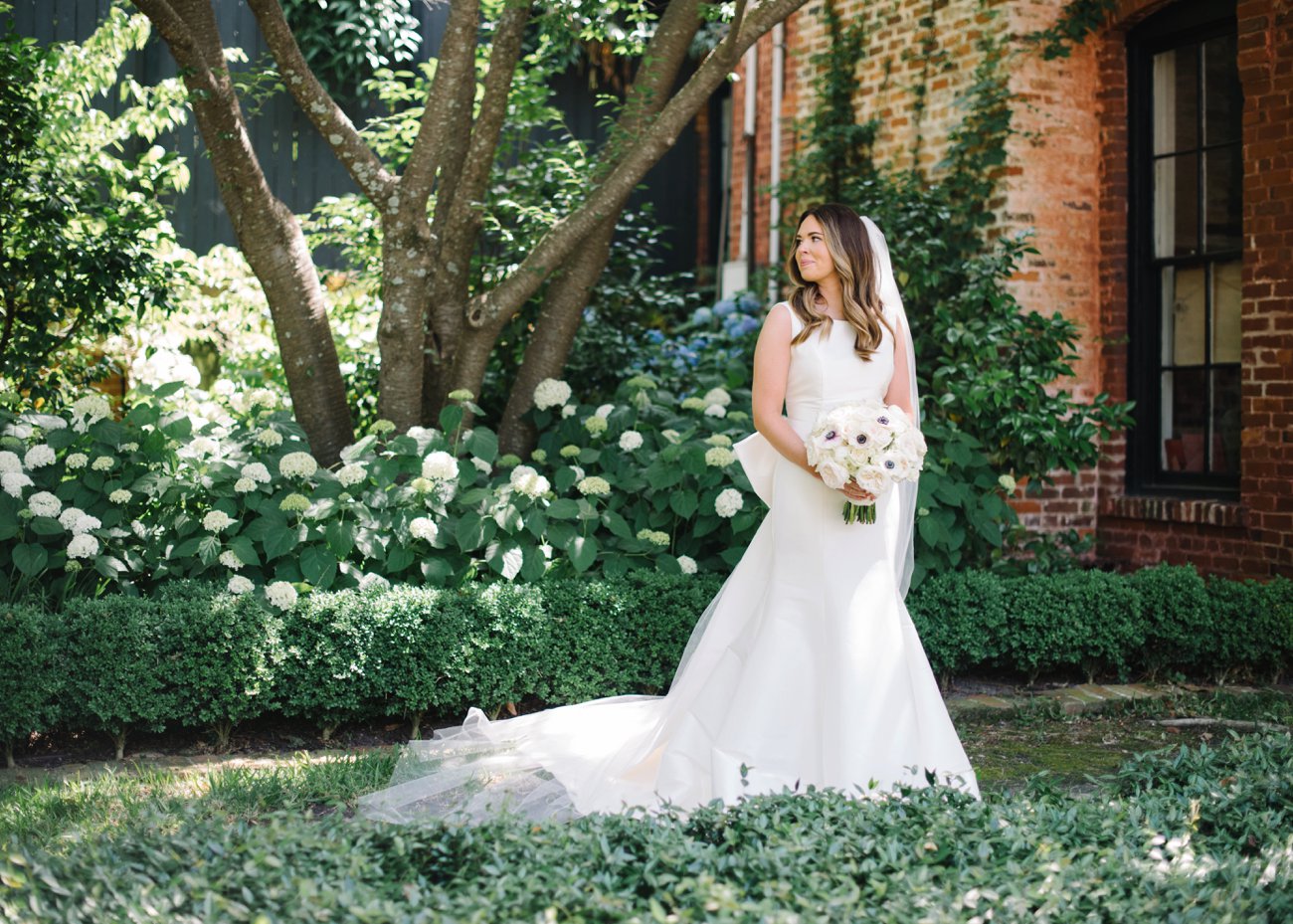Bride outside historic southern brick building