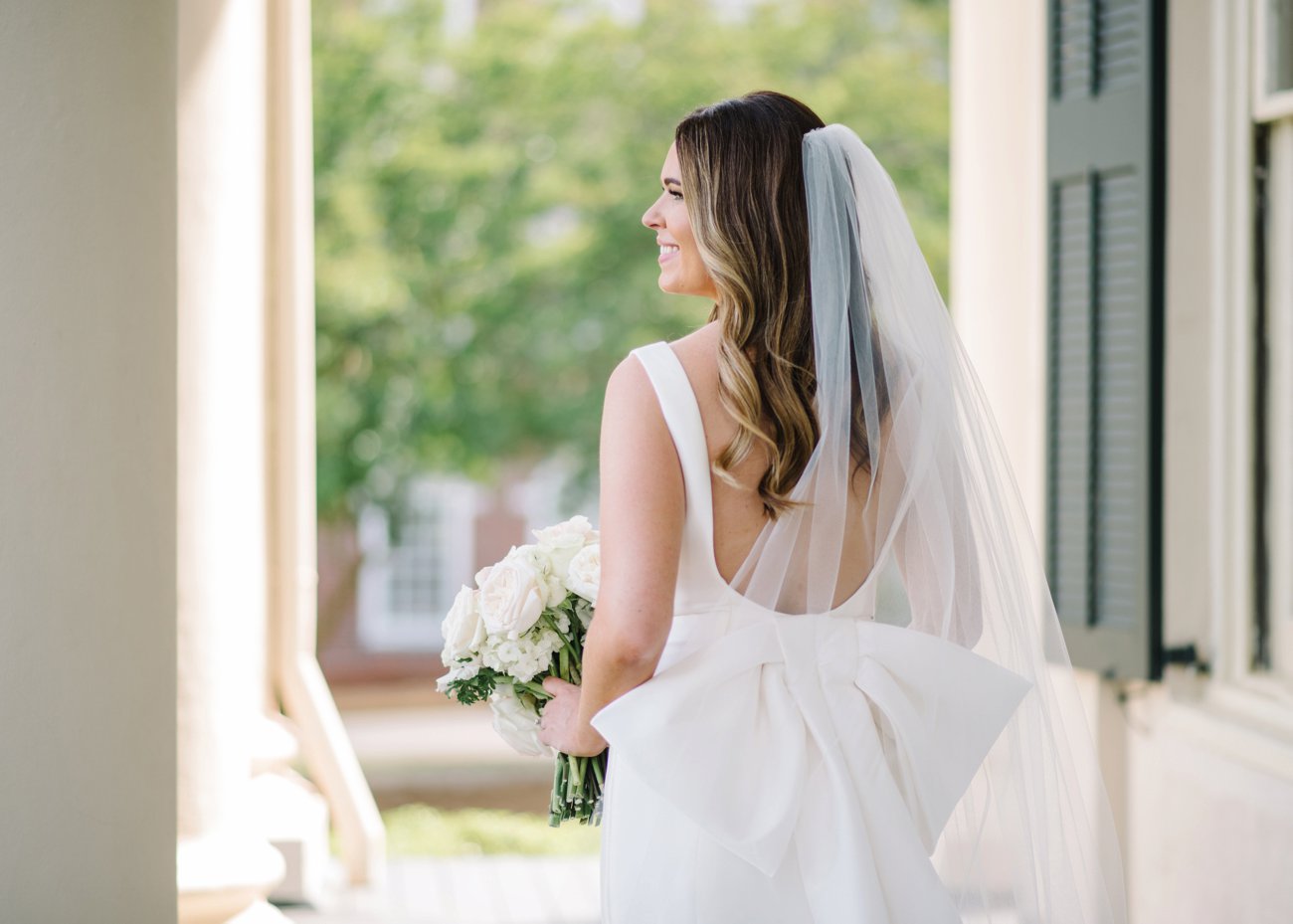 Southern bride in veil with large bow on dress