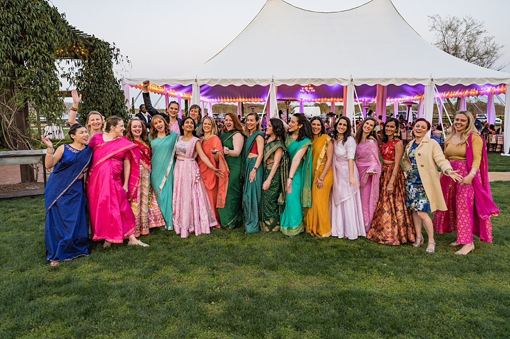 Guests in colorful outfits at Hindu-American wedding