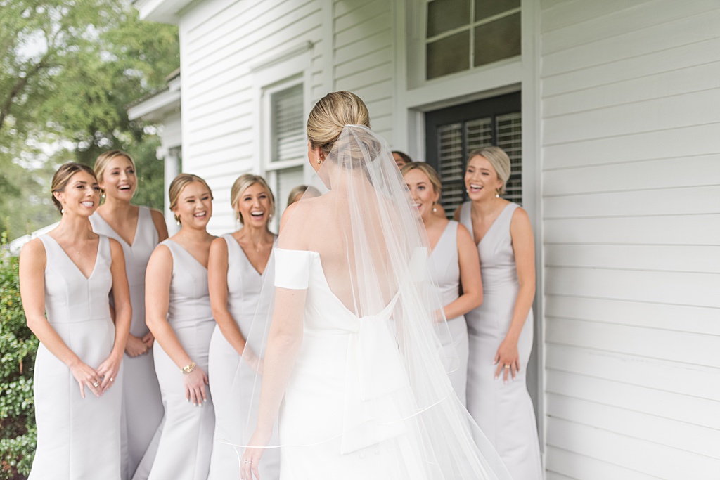 Bride seeing bridesmaids on wedding day