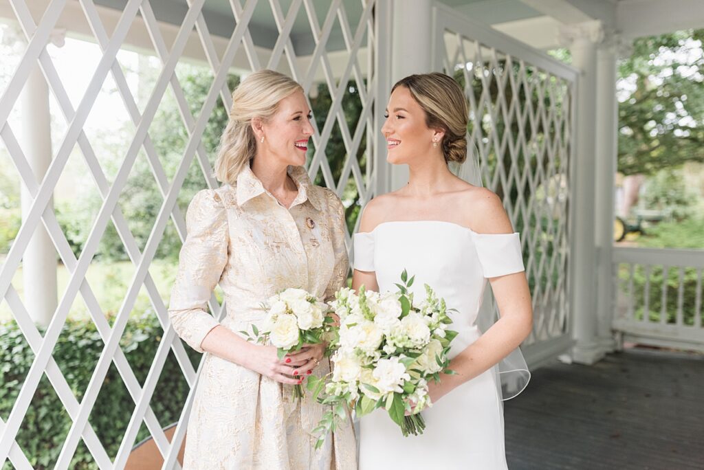 Mother and daughter smiling on the bride's wedding day