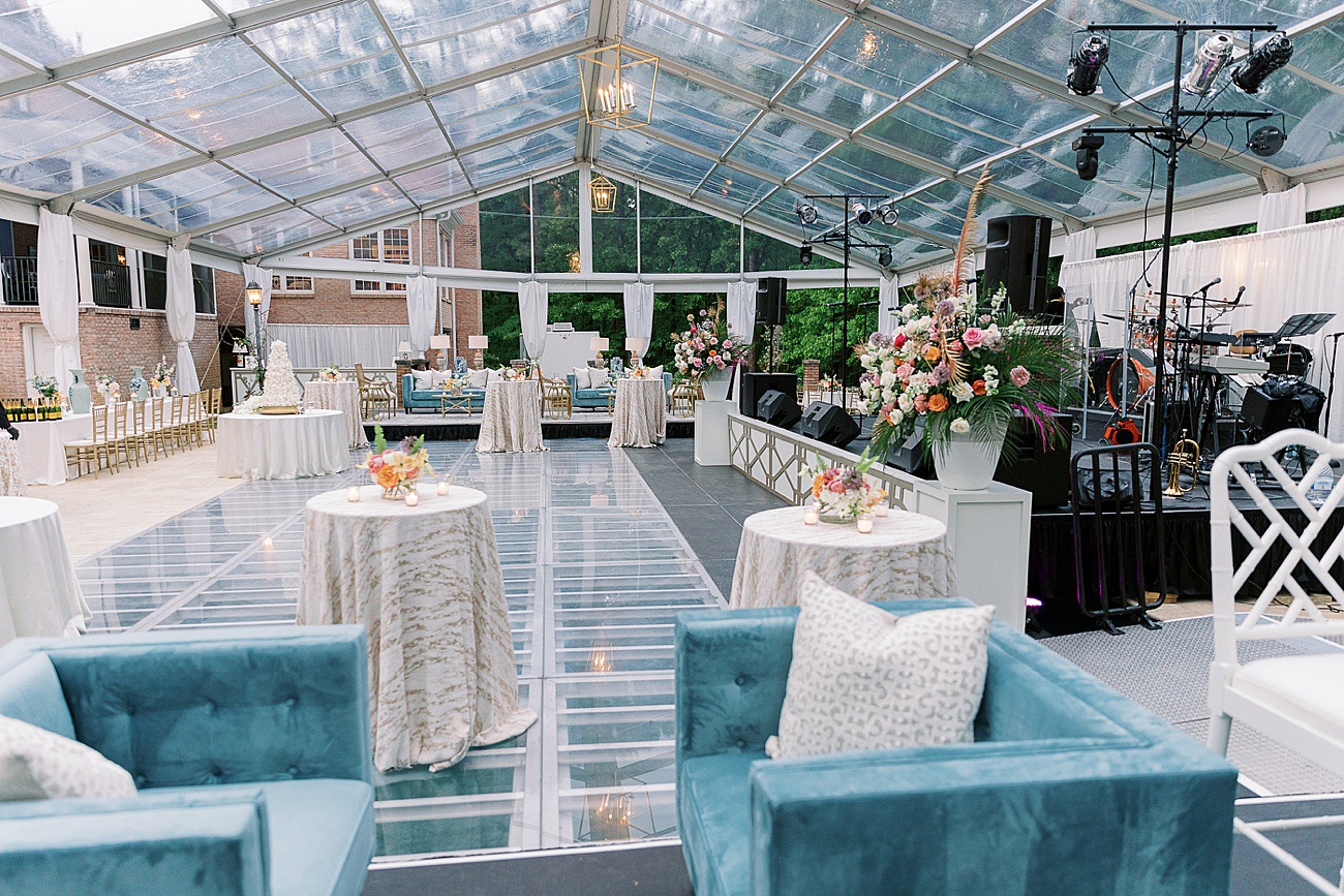Clear top outdoor tented wedding reception in Macon Georgia with a dance floor over the pool